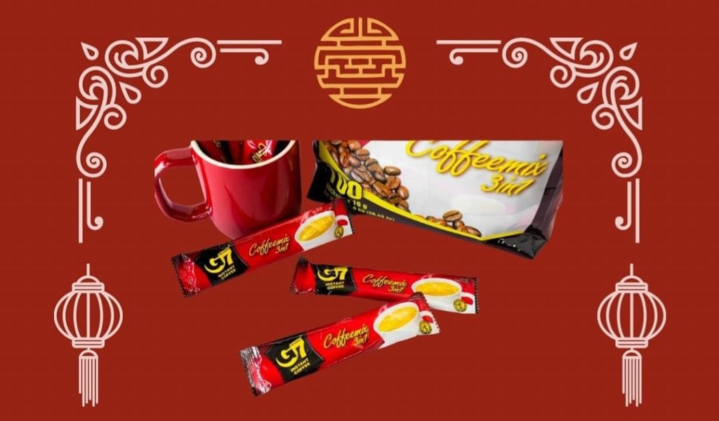 A vibrant red recipe blog composition featuring traditional Chinese decorative elements, with a red mug, packets of coffee-mate, and a few candy wrappers arranged artistically against the colorful background.